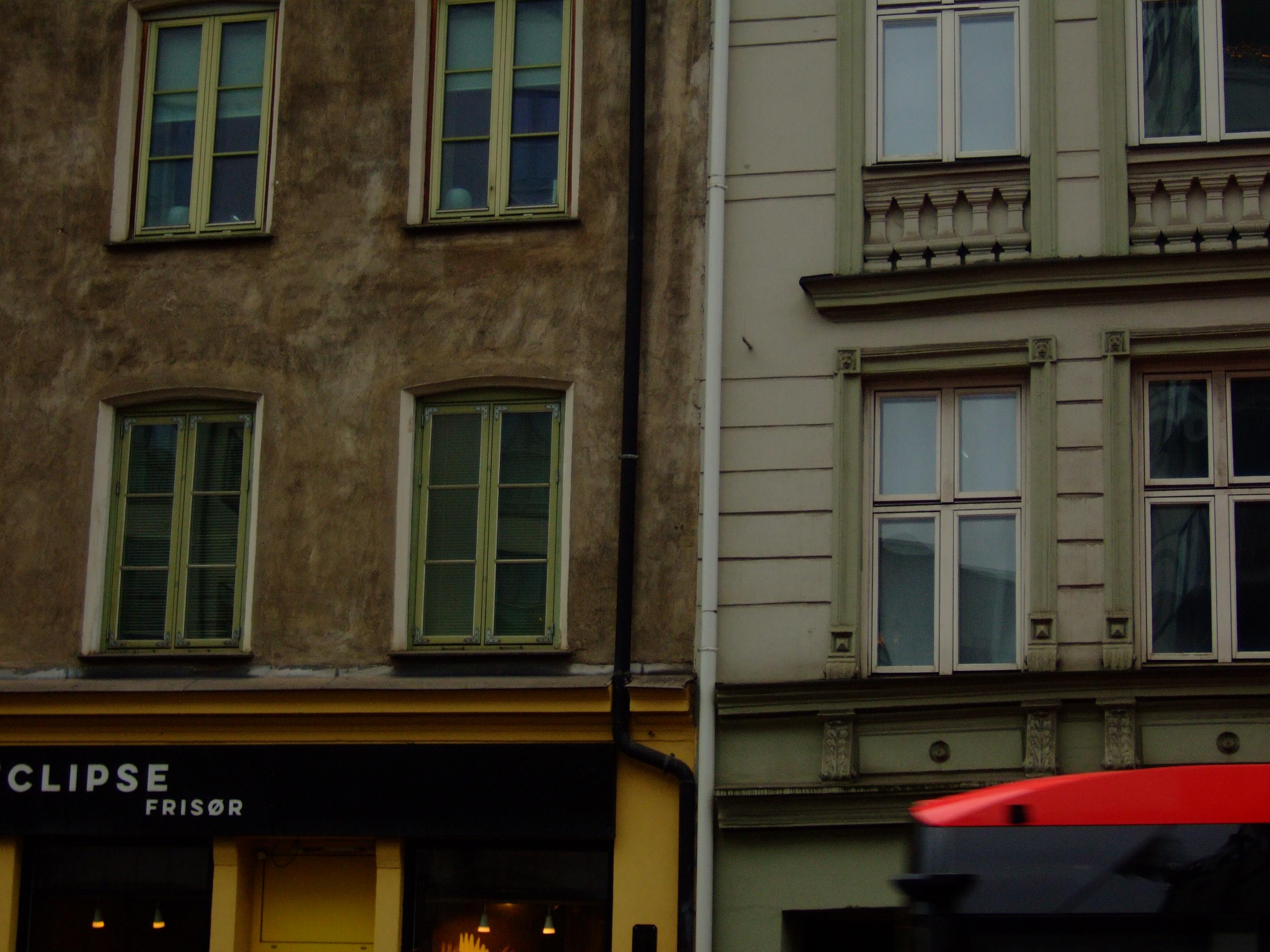 buildings and a passing bus