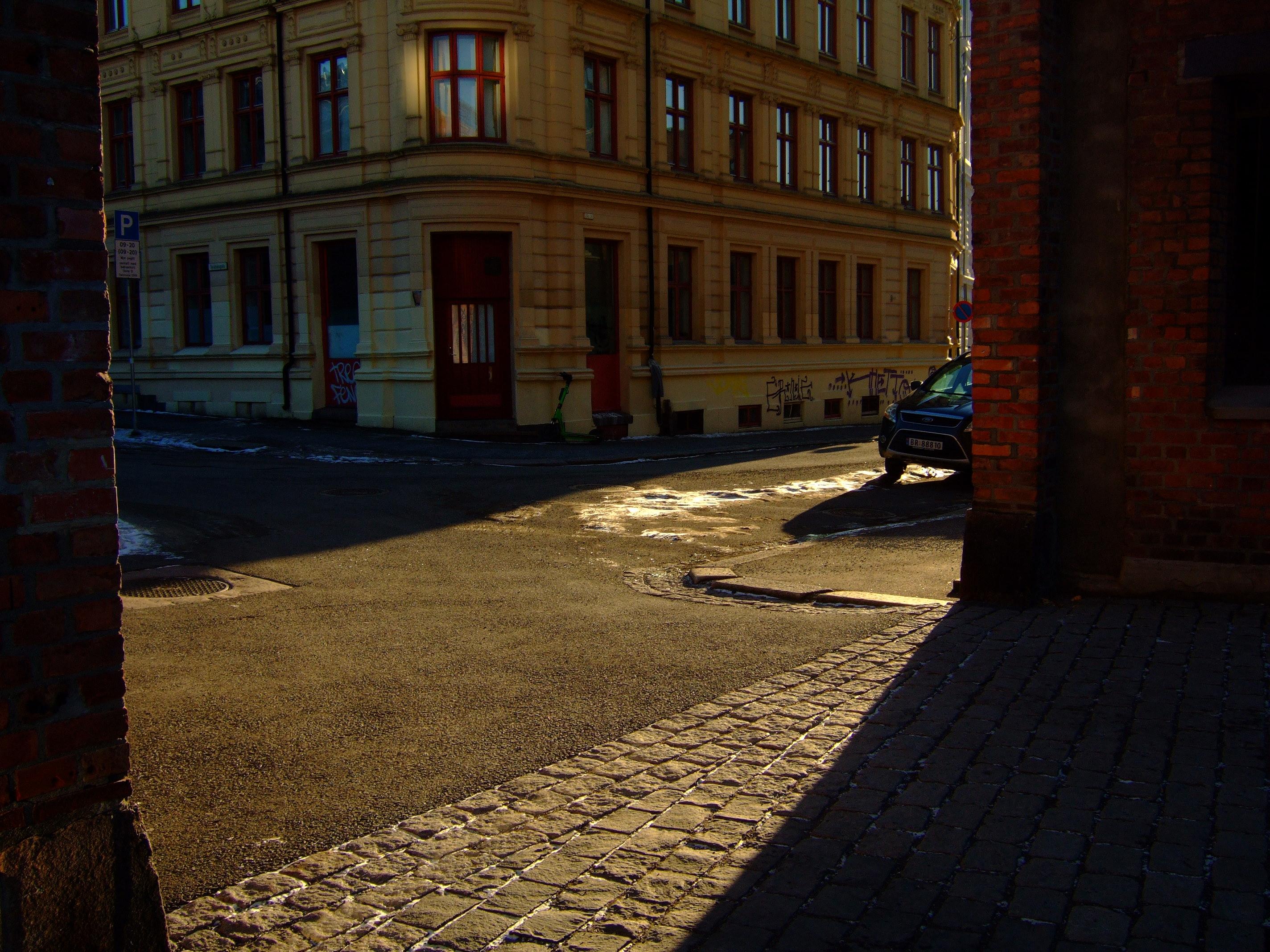 sun passing buildings
