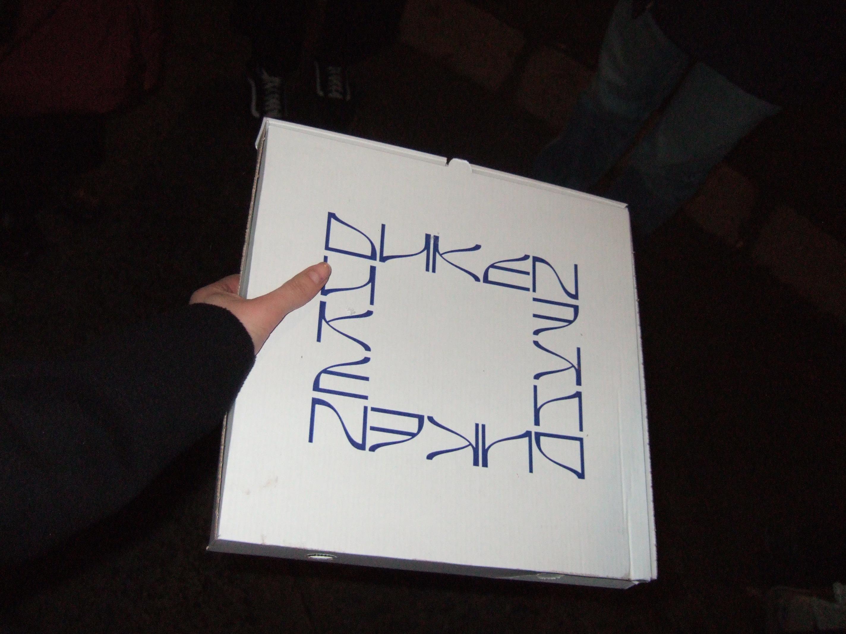 letters on a pizza box